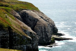 In de verte de Gannet Rock bij St.Mary's
